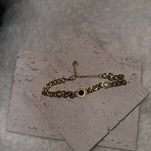 Stainless steel gold overlay  Black Onyx Roman numeral braclet